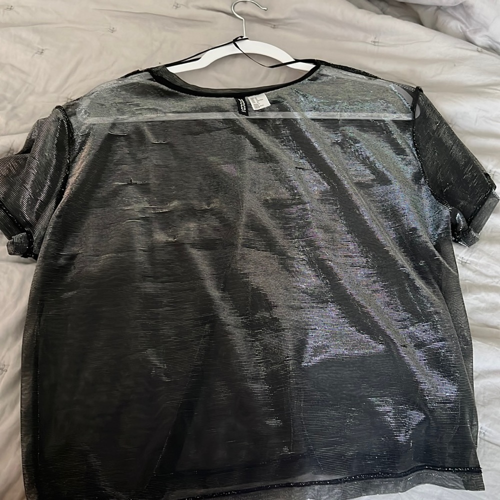 See through mesh shirt . Grey / black - shimmery . Any color looks great under .